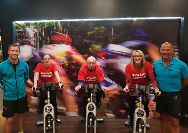 Taking part in the charity cycle challenge are (from left): Chris Nichol (PureGym), Mel Atkins, Michael Evans, Kirstie Gee and Tony Heydon (PureGym)