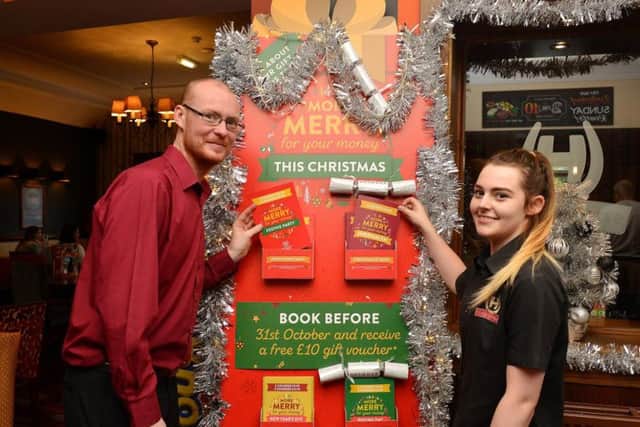 David Lee-Brown, team leader, and Lauren Bateman, team player, promoting the Christmas offer at The Snipe in Sutton.
