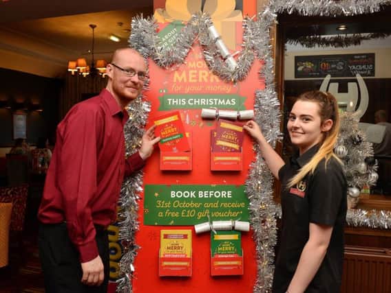 David Lee-Brown, team leader, and Lauren Bateman, team player, promoting the Christmas offer at The Snipe in Sutton.