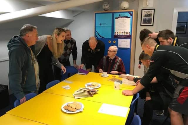 Walter Edwards (seated) with members of Stags Football In The Community and the county council, and also current player David Mirfin.