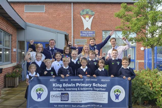 Staff and children of King Edwin Primary School celebrate their good Ofsted result.