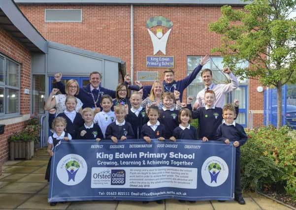 Staff and children of King Edwin Primary School celebrate their good Ofsted result.