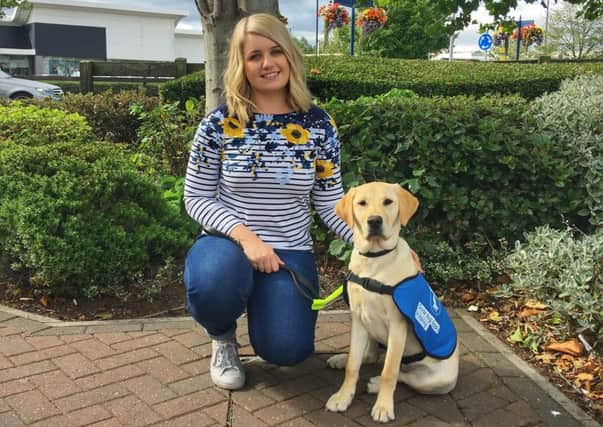 Miss Mansfield, Jessica Pinnick, with the guide dog puppy, Ohio, she has named and sponsored.