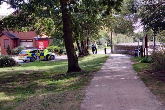 Police at the scene at King's Mill Reservoir today. Picture: Linz Gelsthorpe.