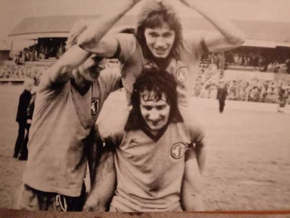 Ian MacKenzie - on the back of Kevin Bird - celebrates the Stags winning the Third Division title with a thrilling 1-0 win at championship rivals Wrexham in May 1977. Billy McEwan also joined the celebrations for this well-remembered photo.