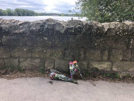 Flowers have been laid at King's Mill Reservoir