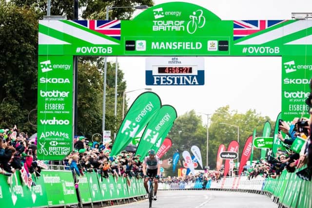 Crossing the finishing line at the end of the Nottinghamshire stage of the Tour Of Britain cycle race in Mansfield. (PHOTO BY: Simon Wilkinson/SWpix.com)