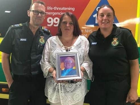 Ronald Morris' daughter Gail with ambulance crew Gillian Woodward and Gary Ellis, who looked after him on his final journey