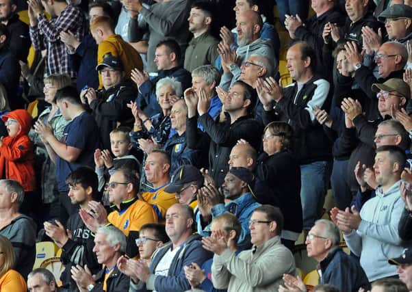 Mansfield Town v Exeter City.
Standing ovation on the 67th minute.