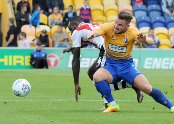 Mansfield Town v Exeter City.
Alex MacDonald in first half action.
