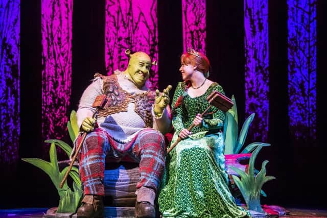 A scene from Shrek, The Musical featuring Shrek and Princess Fiona. Photo by: Tristram Kenton