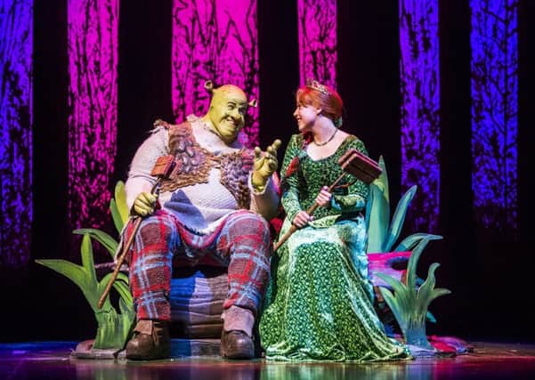 A scene from Shrek, The Musical featuring Shrek and Princess Fiona. Photo by: Tristram Kenton