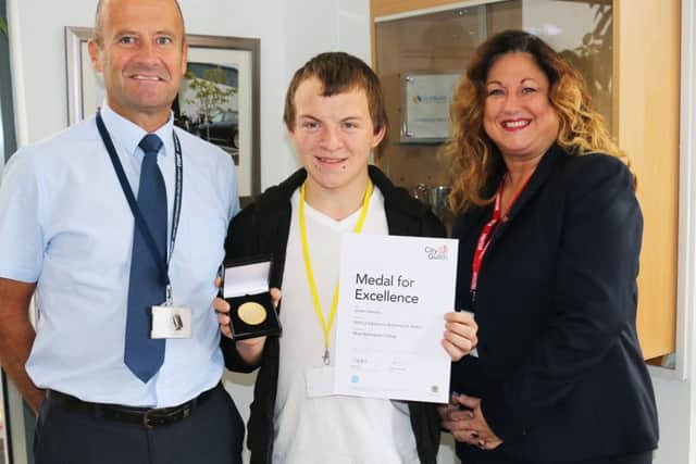 Jordan Harrison with tutor Andy Whyley and Debs Wray from City & Guilds