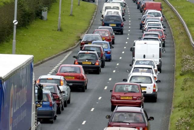 Slow moving traffic on the A64 at Seacroft, at the start of the Bank Holiday Weekend, as motorist make there way towards the Leeds Festival, at Bramham Park, pictured on Thursday 26 August 2004.