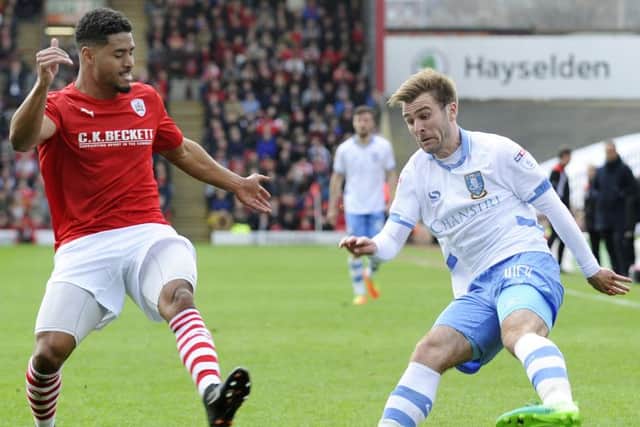 Owls Callum McManaman takes on Reds Saidy Janko....Pic Steve Ellis
