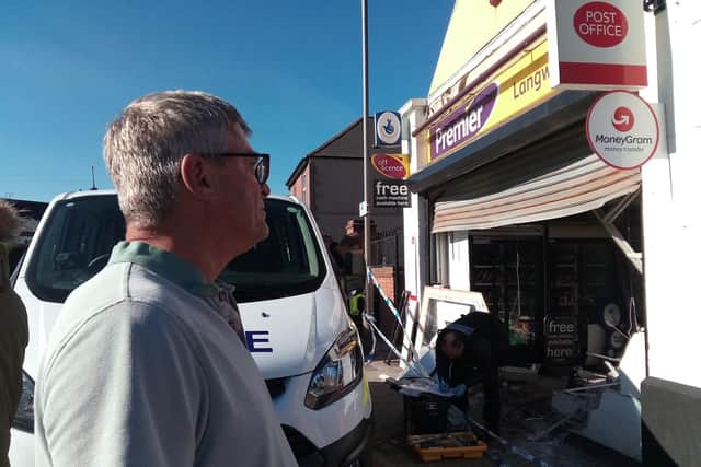 Dave Hill next to the shop.
