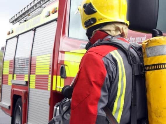 Firefighters are still tackling a large rubbish fire in Rainworth and residents are being asked to keep their windows shut.