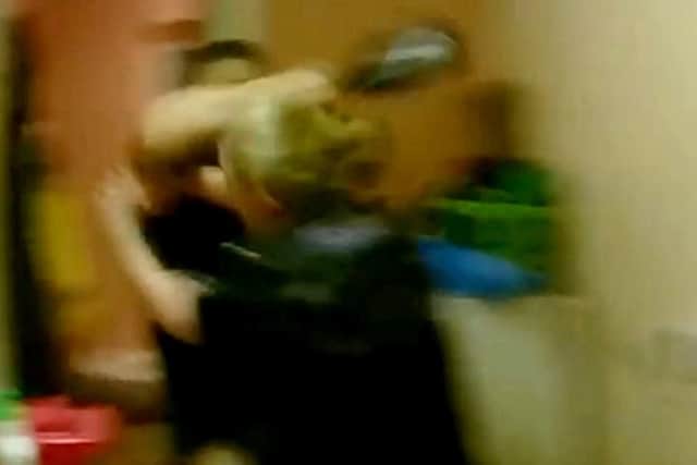He hit her with a bottle.