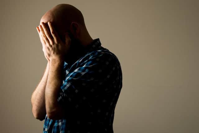 PICTURE POSED BY MODEL A man showing signs of depression.