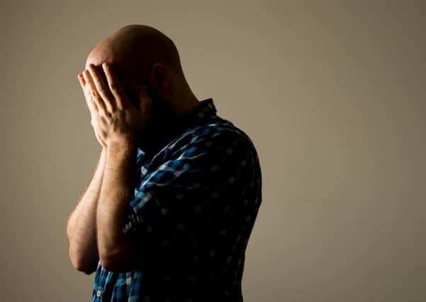 PICTURE POSED BY MODEL A man showing signs of depression.