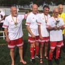 Mansfield Senior Reds in Spain with their trophy.