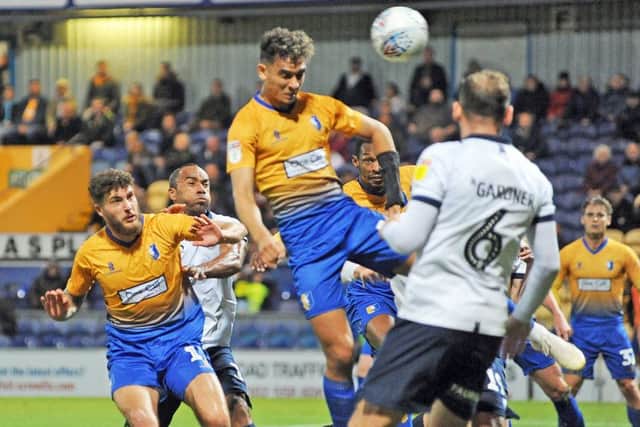 Mansfield Town v Oldham.
Tyler Walker gets in a header in the first half.