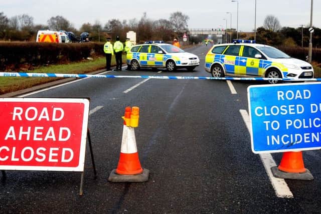 Police on the A614 in Nottinghamshire where six people were killed in a two-car crash.