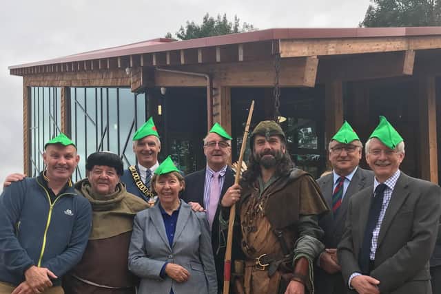 BBC One Show's Mike Dilger, TV's Phil Rose (aka Friar Tuck), and county council representatives at the new visitor centre.