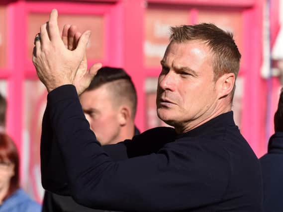 David Flitcroft applauds the Stags fans ahead of the game with Bury.