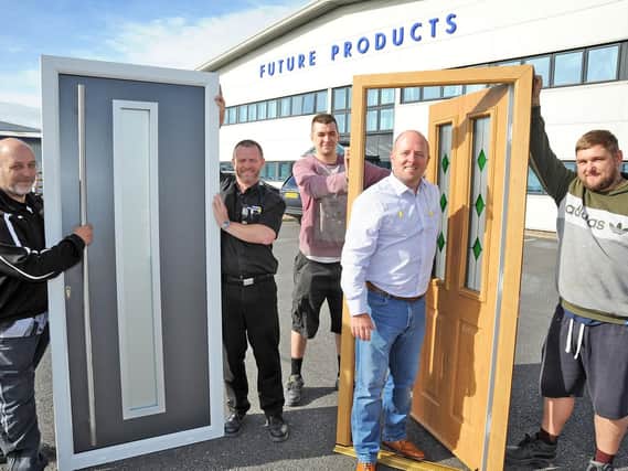 Future Products managing director, Kevin Harvey, second right, with from left, Jamie Collins, factory manager Mark Alton, Josh Dumble and Cameron Graves with some of their doors that have acheived bi-directional fire door safety requirements.