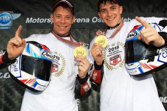 Ben and Tom Birchall celebrate their title win.