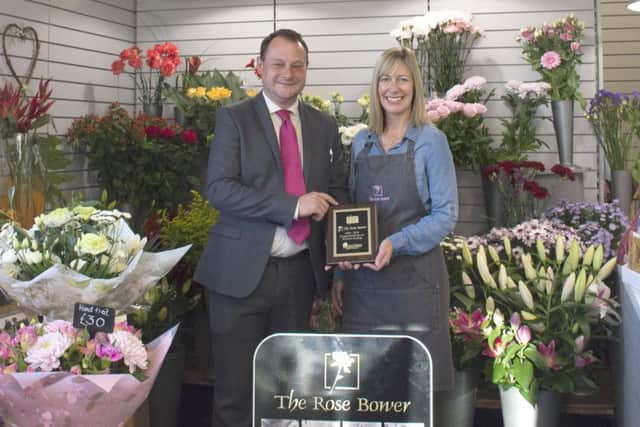 Coun Jason Zadrozny congratulates Ellen Gent, owner of The Rose Bower.