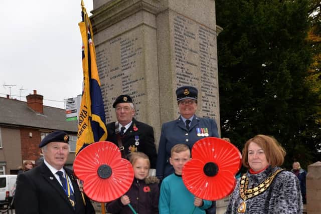 The launch of the Poppy Appeal at Kirkby's war memorial in 2015.