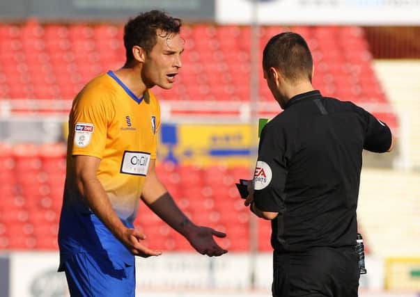 Picture by Gareth Williams/AHPIX.com; Football; Sky Bet League Two; Swindon Town v Mansfield Town; 20/10/18  KO 15:00; The Energy Check County Ground; copyright picture; Howard Roe/AHPIX.com; Mansfield's Will Atkinson pleads with referee Antony Coggins as he gives him a second yellow card at Swindon