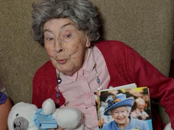 Margaret Young celebrates her 108th birthday at Ashcroft Care Home, Sutton, Margaret is pictured with her card from the Queen
