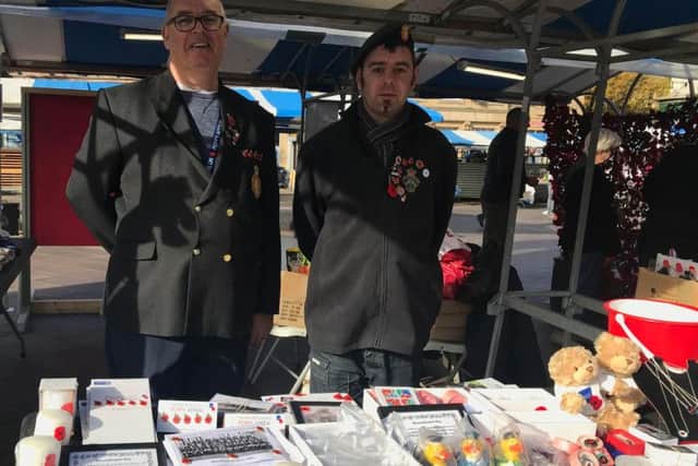 Michael and Matthew Marsh selling RBL items.