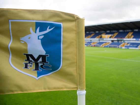 Mansfield host MK Dons at the One Call Stadium.