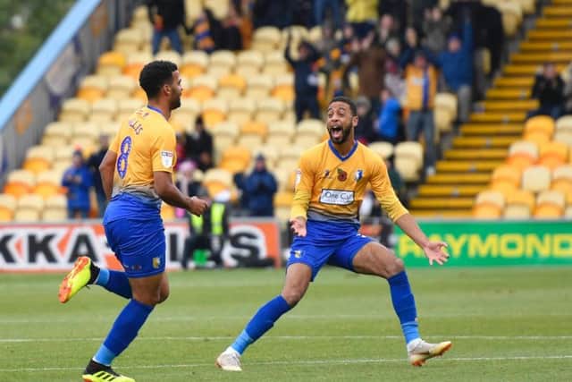 Jacob Mellis (left) celebrates his goal.