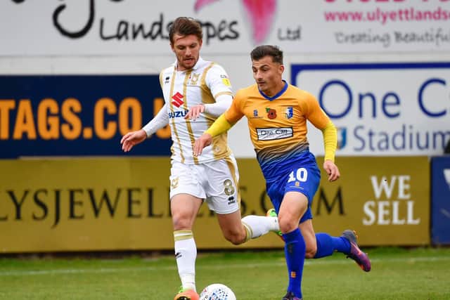 Otis Khan on the ball for Mansfield against MK Dons.