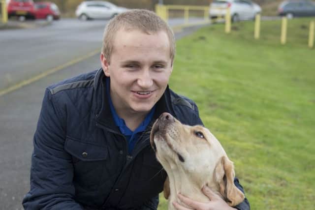 Blind footballer Nathan Edge with his faithful former guide dog, Hudson.