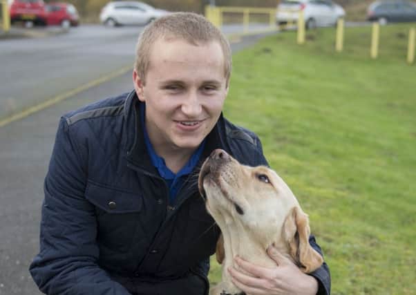 Blind footballer Nathan Edge with his faithful former guide dog, Hudson.