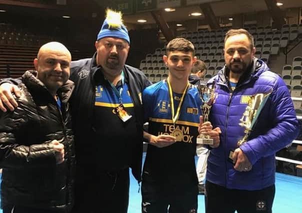 Mansfield boxer Nico Leivars with his coaches after his success in Sweden.