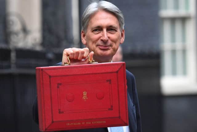 Chancellor Philip Hammond holding his red ministerial box outside 11 Downing Street, London, before heading to the House of Commons to deliver his Budget. PRESS ASSOCIATION Photo. Picture date: Monday October 29, 2018. See PA story BUDGET Main. Photo credit should read: Stefan Rousseau/PA Wire
