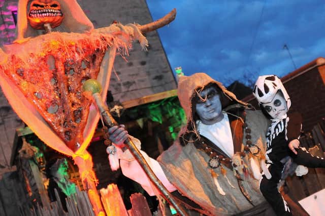 Lee Buckley with son Riley, 4, and other spooks and ghouls at his Halloween spectacular.