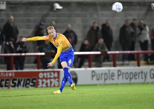 Mansfield Town's Neal Bishop crosses the ball