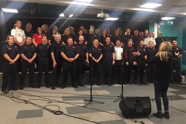 The firefighters record their single for the Firefighters Charity and the Band Aid Charity Trust.
