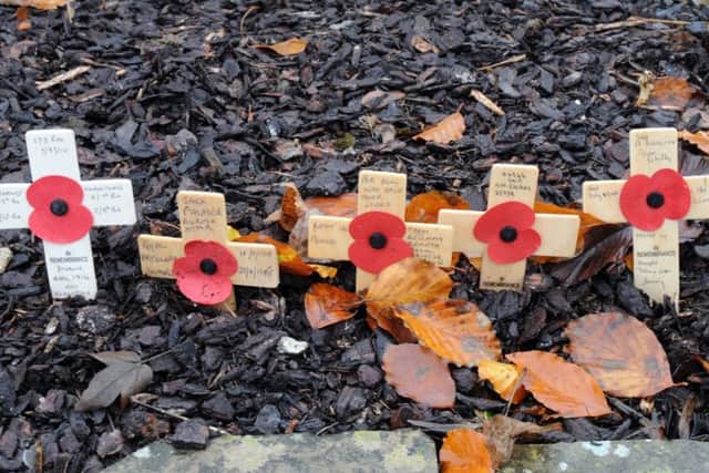 Poppies on wooden crosses at a previous Remembrance Day event in Mansfield.