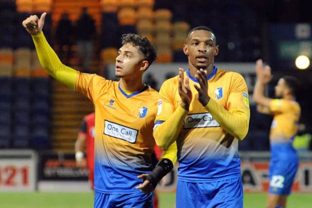 Mansfield Town v  Grimsby Town.Tyler Walker and Krystian Pearce enjoy the applause after the final whistle.
