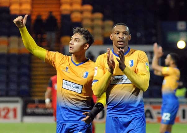 Mansfield Town v  Grimsby Town.
Tyler Walker and Krystian Pearce enjoy the applause after the final whistle.