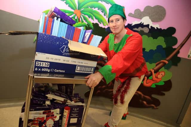 Mathew Gibson has been in and out of hospital and wanted to give something back so he is handing out presents on Ward 25 at Kings Mill Hospital.